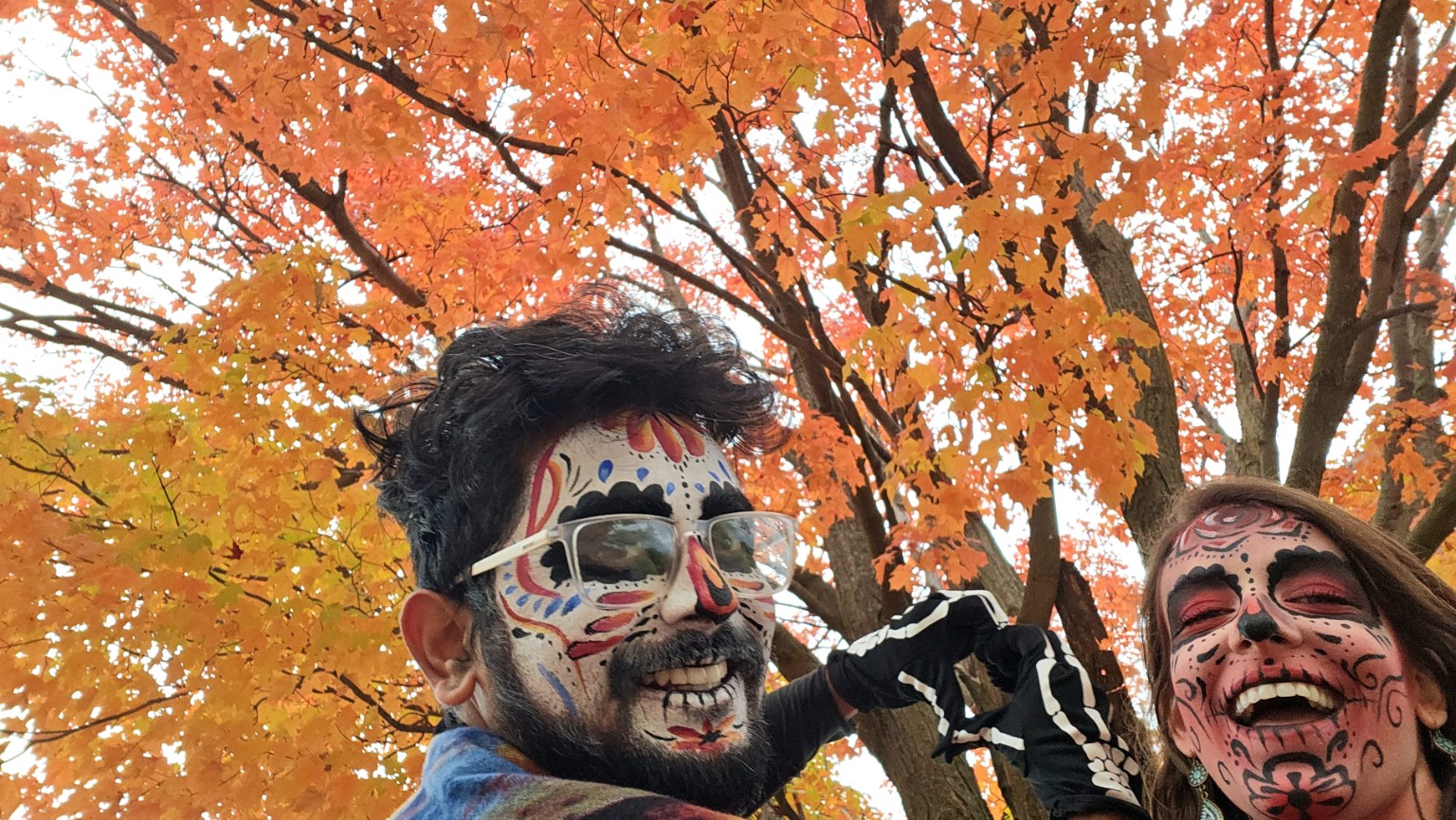 Colorful Day of the Dead face painting outdoors