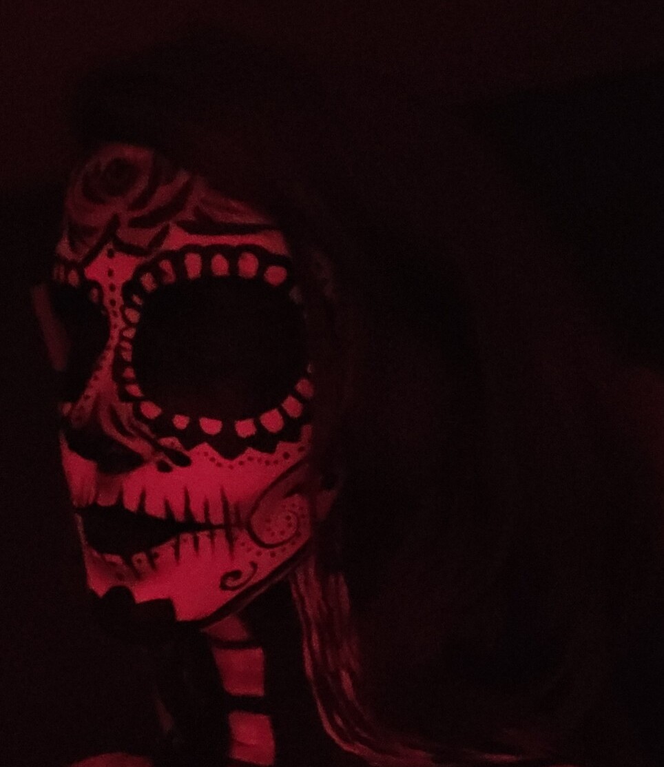 Red and black Day of the Dead body painting