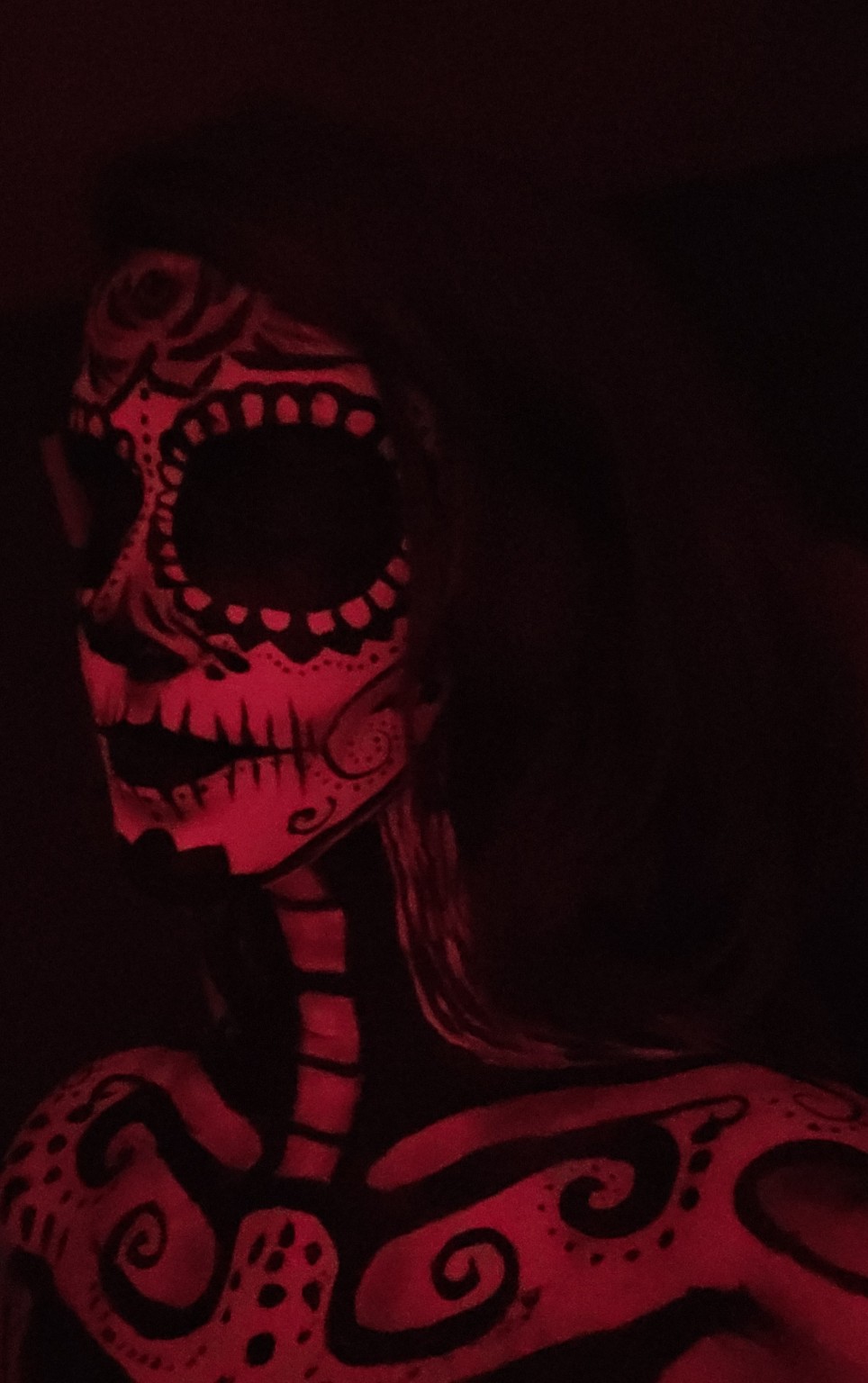 Red and black Day of the Dead body painting