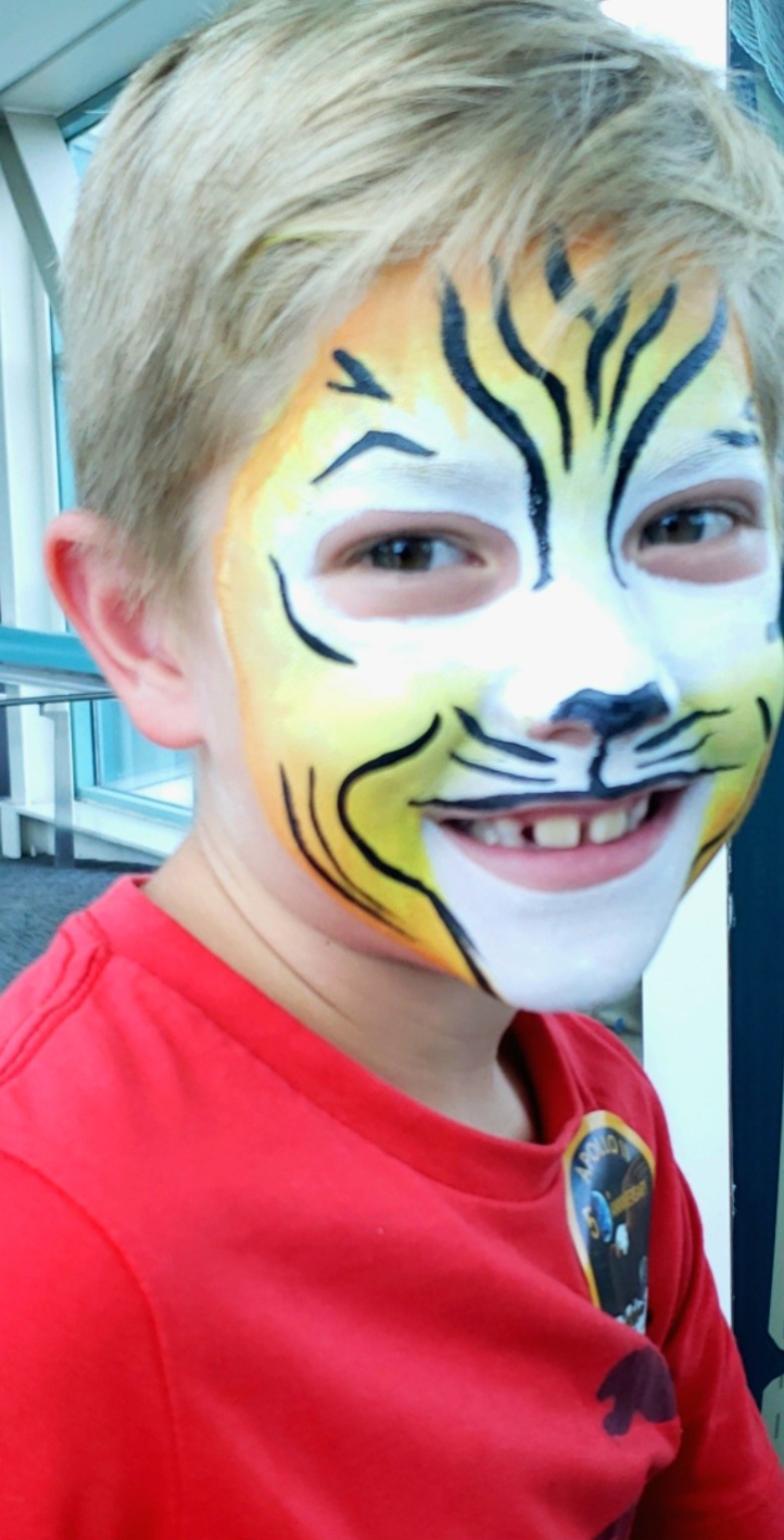 Tiger face painting for a child